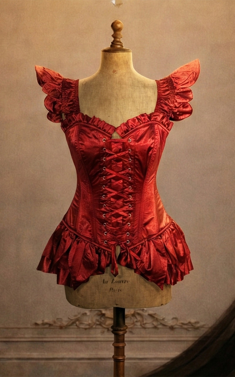 Red fairy corset on a mannequin against a vintage wall with a chandelier - madame mortelle