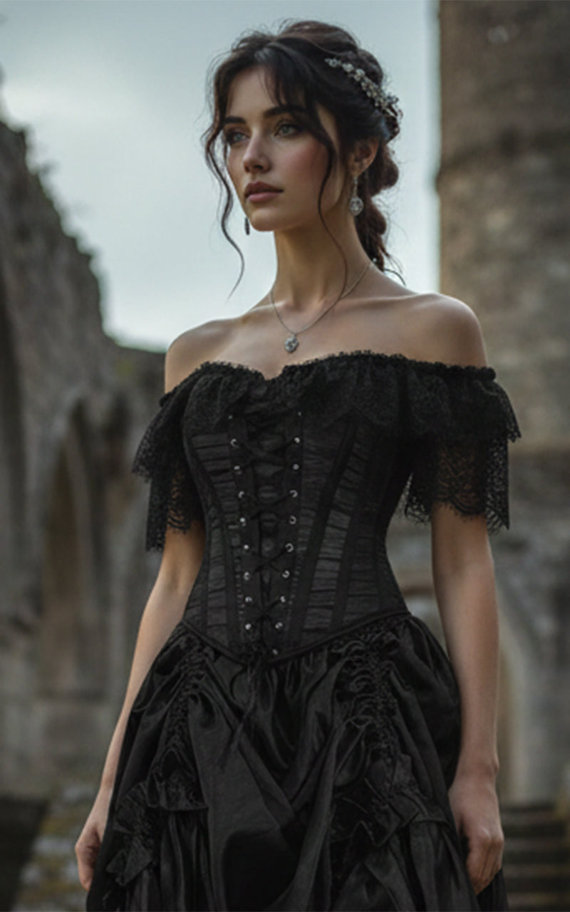 Woman wearing a black gothic lace corset and black satin skirt with intricate details in an outdoor setting